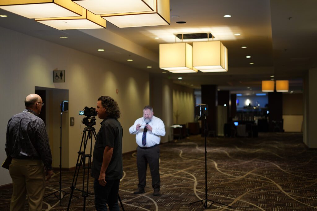 Robert Johnston and Kasey Atkins get ready to interview Sunny Duerr for the AAQEP film production shot at the Hilton salt Lake City Center.
